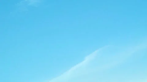 Light White Clouds Like a Feather in a Pure Light Blue Sky during the Daytime an 库存影片 330650733