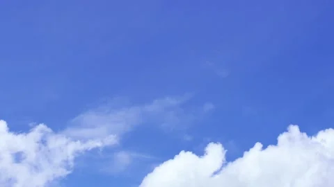 Light white clouds flew past in the bright blue sky. The summer of the sun's sco Stock-Footage 163710807