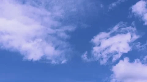 Light white clouds flew past in the bright blue sky. The summer of the sun's sco Stock Footage 163710808