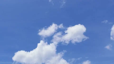 Light white clouds flew past in the bright blue sky. The summer of the sun's sco Stock-Footage 163710833