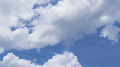 Light white clouds flew past in the bright blue sky. The summer of the sun's sco Stock-Footage 163710834