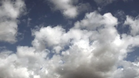  Light white clouds moving across the blue sky. Stock Footage 106354574