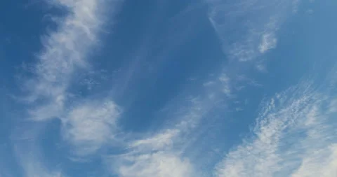 Light white clouds moving in the sky Stock Footage 93863313