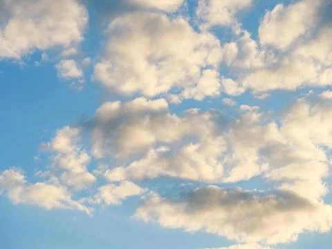 Light white clouds in sunlight against a sky Stock Photos