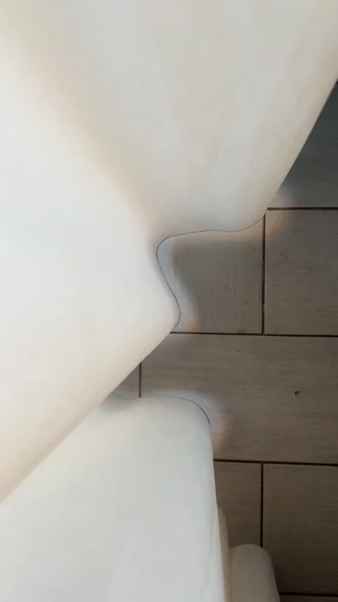 Light white curtain moves due to wind. Gray tiles on floor Stock Footage 285249408