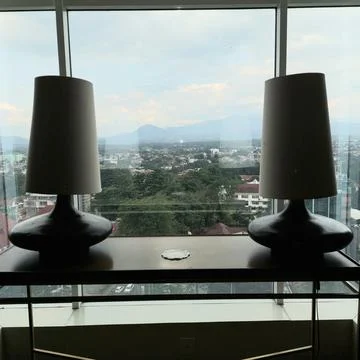 The light in the window with the city background Stock Photos