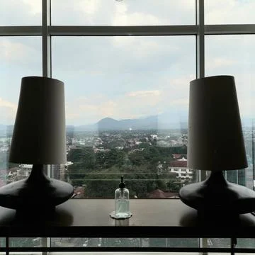 The light in the window with the city background Stock Photos