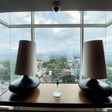 The light in the window with the city background Stock Photos