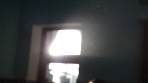 Light from the window. ray of sunshine in a dark room. dust particles fly Stock Footage 72176814