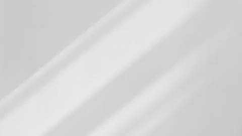 Light from the window shines on wall, shadow lines from the curtain is moving Vídeo Stock 143781702