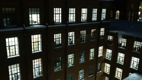Light from the windows of the facade of a business building Stock Footage 201053897