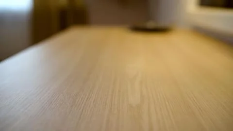 Light wood table surface with natural grain texture and soft focus background Stock Photos