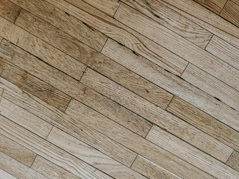 Light wooden floor with a diagonal pattern showcasing natural grain and tex.. Stock Photos