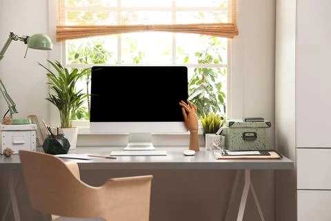 Light work place with computer near window at home. Interior design Stock Photos