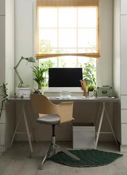 Light work place with computer near window at home. Interior design Stock Photos