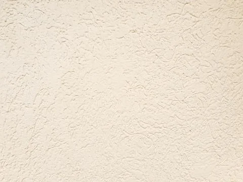 Light yellow beige plaster background. Wall texture, full frame Stock Photos