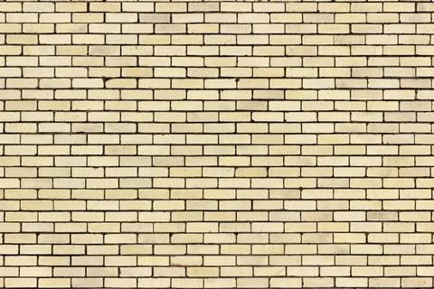 Light Yellow Brick Wall Pattern Background From a Distance Stock Photos