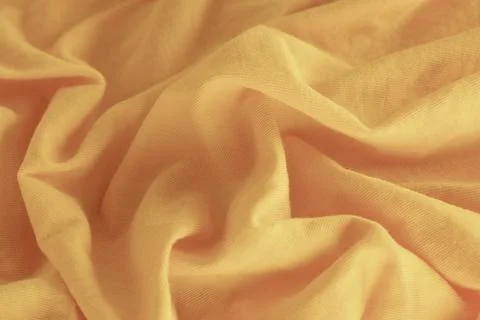 A light yellow fabric texture background. Close up. Stock Photos