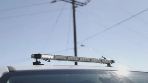 Lightbar with a horizontal yellow and white pattern on a work truck with Stock Footage 235961766