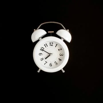 Lightbox alarm clock on black background. Flat lay Stock Photos
