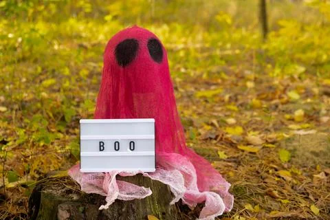Lightbox BOO text Creative handmade Halloween holiday decoration. pink ghost in 写真素材