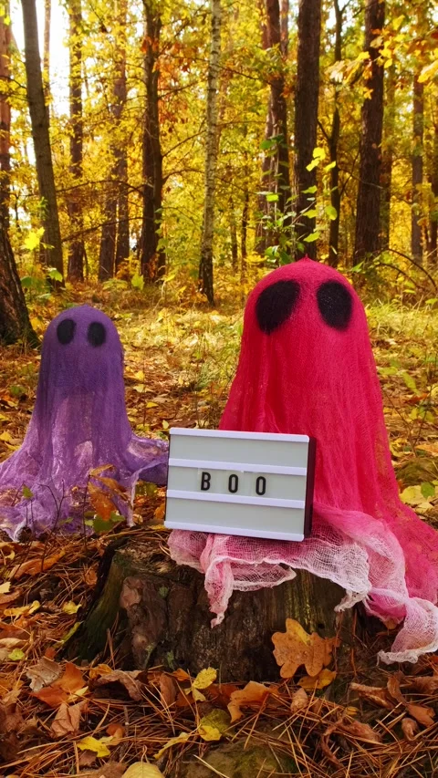 Lightbox BOO text Trick or treat halloween colorful ghosts made of bandages in Stock Footage 278131475