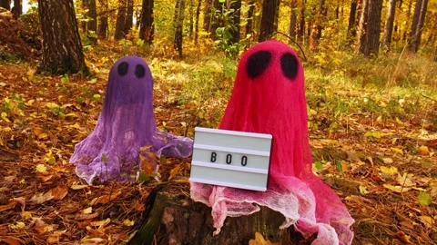 Lightbox BOO text Trick or treat halloween colorful ghosts made of bandages in Stock Footage 282831277