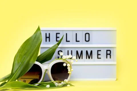 Lightbox with message Hello Summer on yellow background. Concept of summer,tr Stock Photos