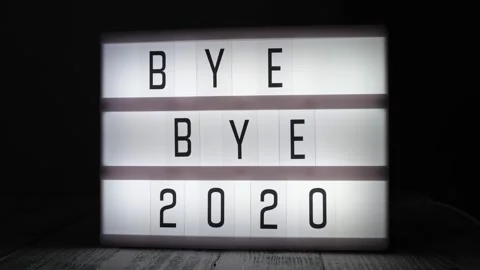 Lightbox with text BYE BYE 2020 in dark room Stock Footage 143237018