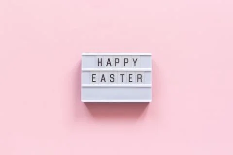 Lightbox text Happy Easter on pink paper background. Concept Easter minimal Stock Photos