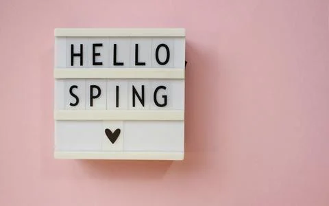 Lightbox with text Hello spring on pink background. Top view Flat lay Springt Stock Photos