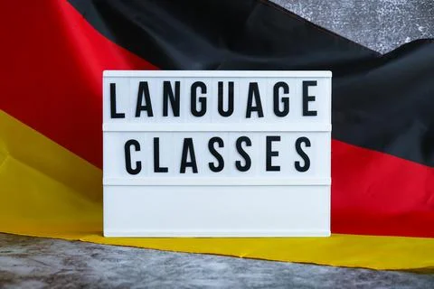Lightbox with text LANGUAGE CLASSES National symbol of Germany. German wave Stock Photos