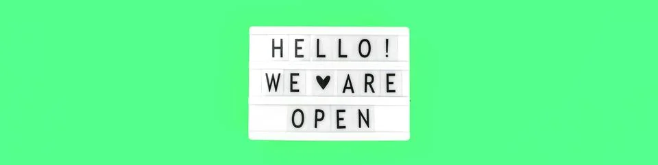 Lightbox with text message Hello we are open sign, banner with notification a Stock Photos