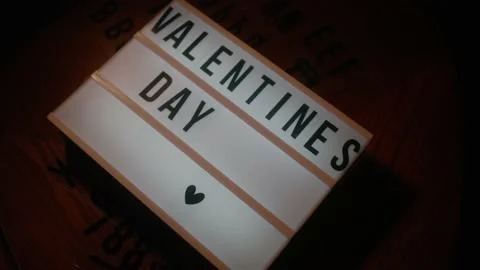 Lightbox on with text VALENTINES day on night city background. St. Valentine's Stock Footage 147555549