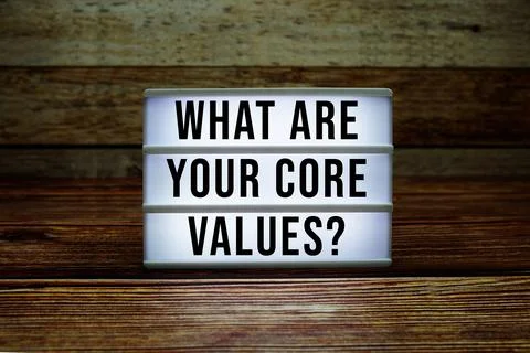 Lightbox with text "What Are Your Core Values?" on wooden background Stock Photos