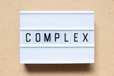 Lightbox with word complex on wood background Stock Photos