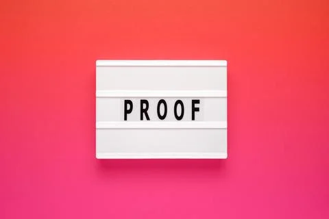 Lightbox with word proof on pink background. Business Concept image. Foto stock