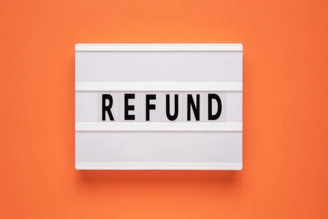 Lightbox with word refund on orange background. Business concept Stock Photos
