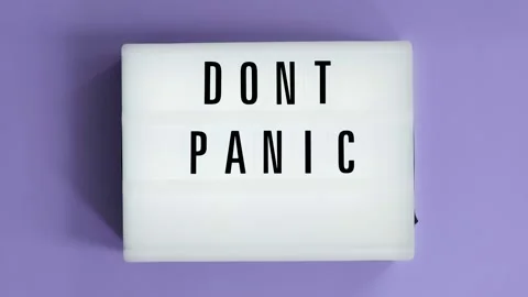 Lightbox with a words text Don't Panic board on violet background. Stock Footage 143617666