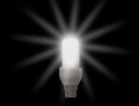 Lightbulb on black Stock Photos