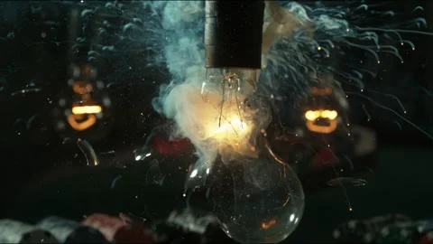 A lightbulb explodes in stunningly sharp, slow motion, which reveals bits Stock Footage 242562792