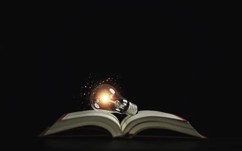 Lightbulb glowing on book over dark background for creative thinking idea a.. Stock Photos