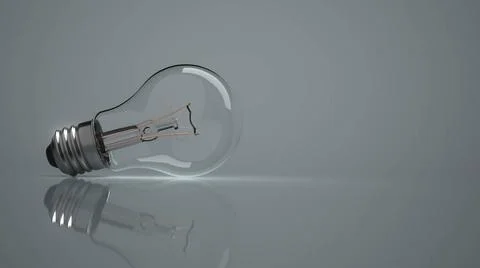 Lightbulb Grey Background A lightbulb in on the grey background. 3d illust... Stock Photos