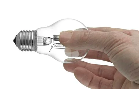 Lightbulb in a hand isolated on white background. Stock Photos