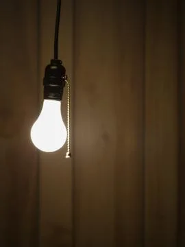 Lightbulb hanging from ceiling Stock Photos