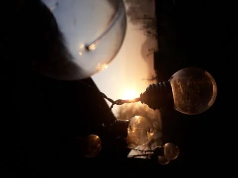 Lightbulb on sunset background 写真素材