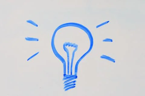 Lightbulb on white board Stock Photos