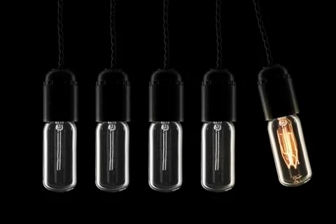 Lightbulbs swinging pendulum Stock Photos