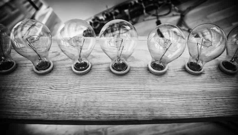 Lighted bulb for light Stock Photos