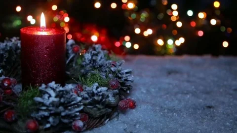 A lighted candle and a gift box on the background of a bokeh Stock-Footage 82608618